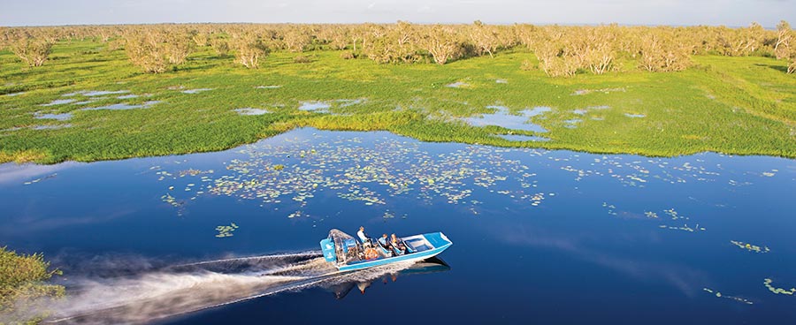 Air boat speeding across a lake